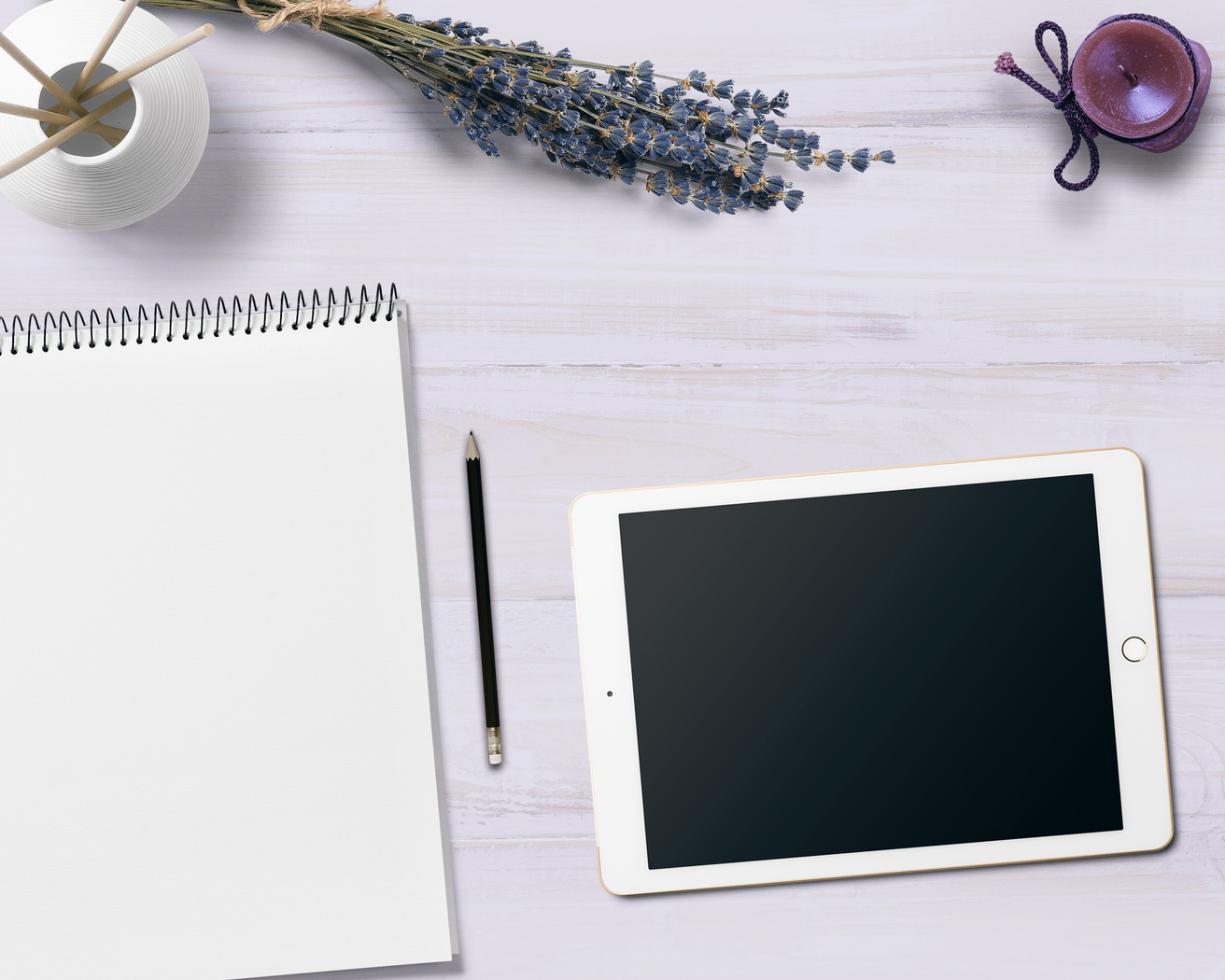 Tablet and Notebook on the Desk